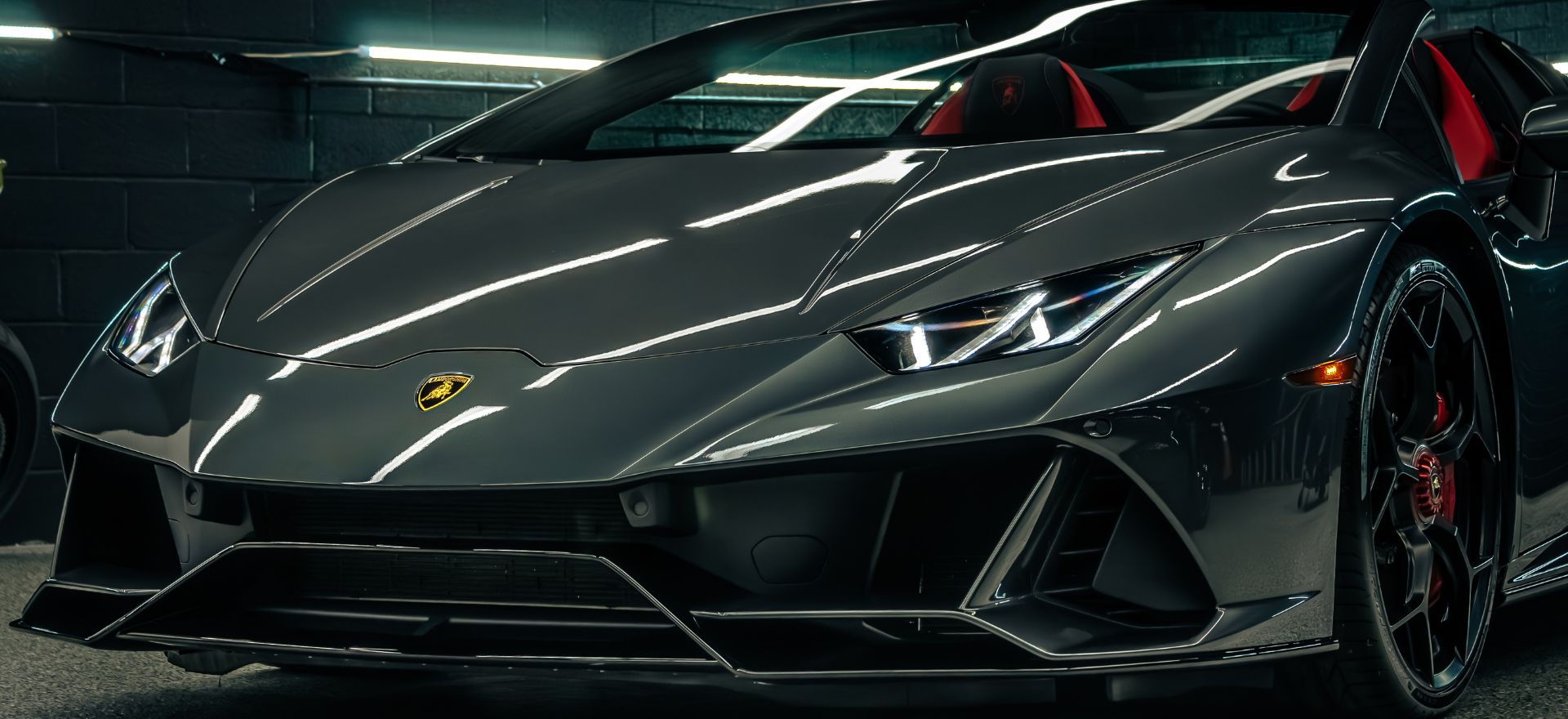 A sleek Lamborghini Huracan Evo LP610-4 sports car in a vibrant color, showcasing its aerodynamic design and luxury features.